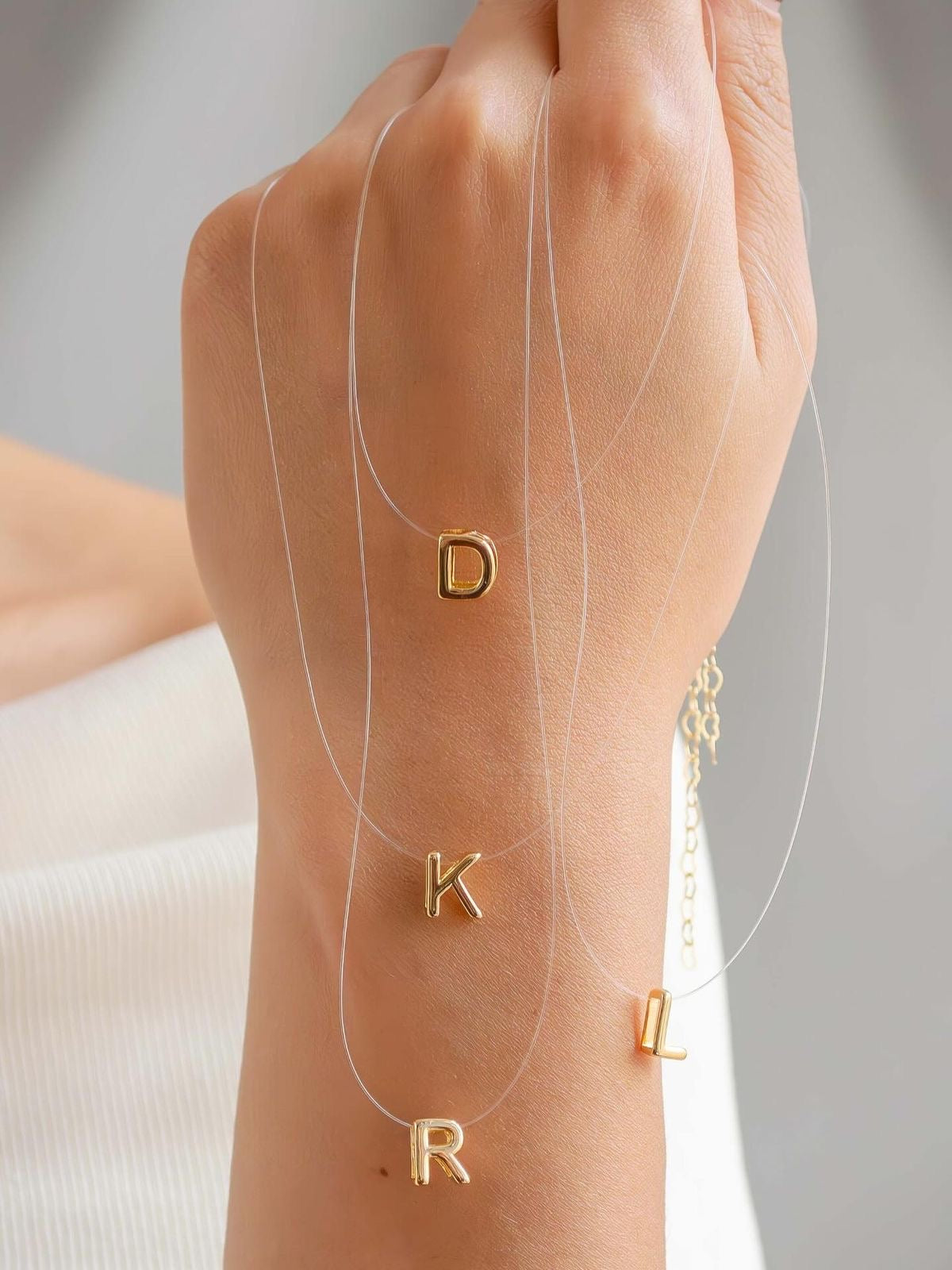 Invisible initial necklace